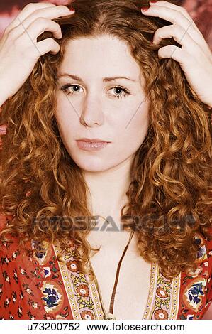 Stock Image - Curly haired redhead. Fotosearch