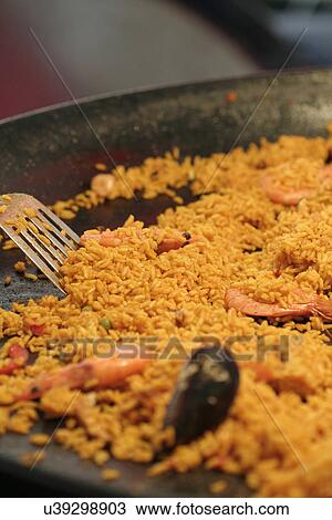 Stock Image - Frying quinoa. Fotosearch