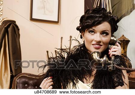 Glamour woman talking on antique phone View Large Photo Image Stock Photo - Glamour woman talking on antique phone. Fotosearch