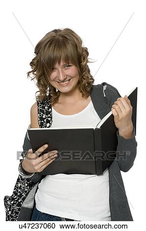 Happy young woman holding a large book View Large Photo Image Stock Image - Happy young woman holding a large book. Fotosearch