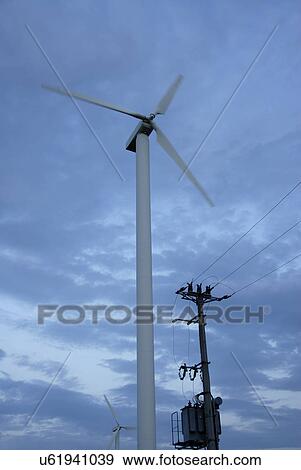 Low angle view of wind turbine View Large Photo Image Stock Photo - Low angle view of wind turbine. Fotosearch