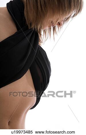 Low angle view of young woman View Large Photo Image Stock Photography - Low angle view of young woman. Fotosearch