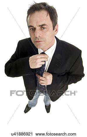 Man adjusting tie View Large Photo Image Stock Image - Man adjusting tie. Fotosearch