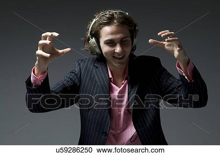 Stock Image - Man wearing headphones. Fotosearch