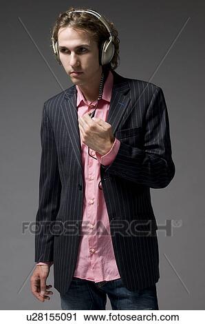 Stock Image - Man with headphones on. Fotosearch