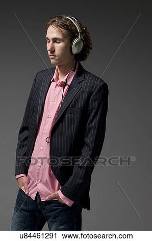 Man with headphones on View Large Photo Image Stock Image - Man with headphones on. Fotosearch