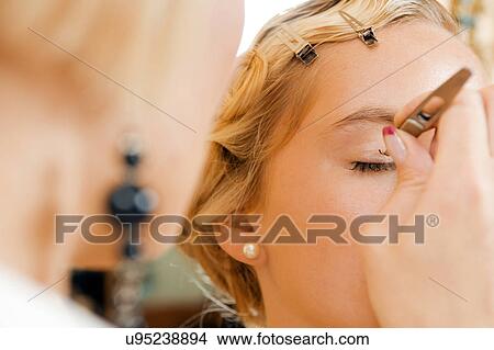 Model having her makeup done View Large Photo Image Picture - Model having her makeup done. Fotosearch