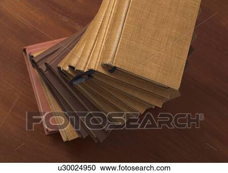 Stock Image - Overhead view of book stack. Fotosearch