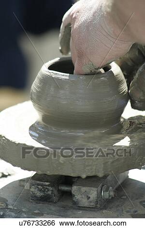 Stock Photograph - Potter at work. Fotosearch