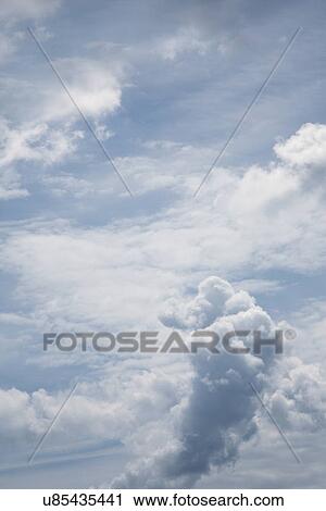 Stock Image - Puffy clouds. Fotosearch