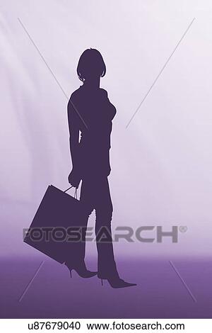 Silhouette of woman holding shopping bag View Large Photo Image Stock Image - Silhouette of woman holding shopping bag. Fotosearch