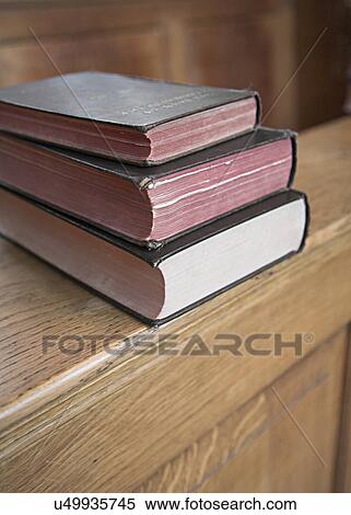 Stock Photography - Three books in a stack. Fotosearch
