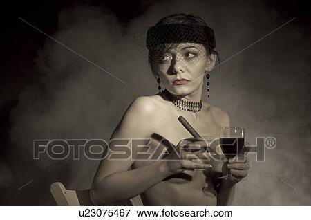 Topless woman, holding wine and cigar View Large Photo Image Stock Photo - Topless woman, holding wine and cigar. Fotosearch