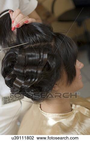 Stock Image - Woman at hairdresser. Fotosearch