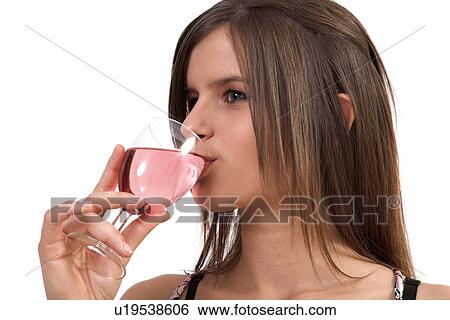 Stock Photograph - Woman drinking white wine. Fotosearch