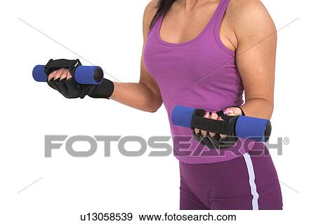 Woman exercising with weights View Large Photo Image Stock Photo - Woman exercising with weights. Fotosearch