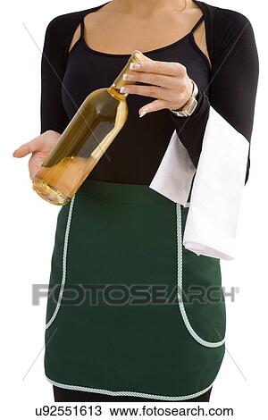 Stock Image - Woman holding a bottle of wine. Fotosearch