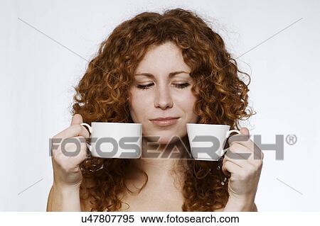 Woman holding cups View Large Photo Image Stock Photography - Woman holding cups. Fotosearch