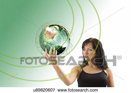Stock Photo - Woman holding globe. Fotosearch