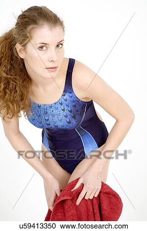 Woman in swimming suit drying off with towel View Large Photo Image Stock Image - Woman in swimming suit drying off with towel. Fotosearch