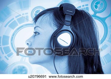 Woman listening to headphones View Large Photo Image Stock Image - Woman listening to headphones. Fotosearch