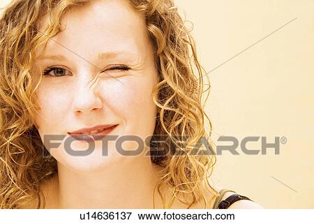 Woman winking View Large Photo Image Stock Photo - Woman winking. Fotosearch