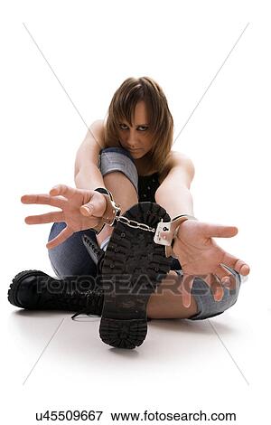 Stock Photo - Woman with handcuffs. Fotosearch