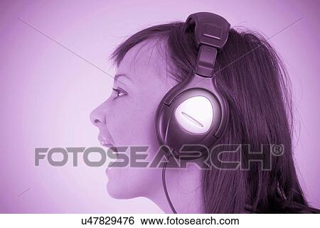 Woman with headphones singing View Large Photo Image Stock Photograph - Woman with headphones singing. Fotosearch