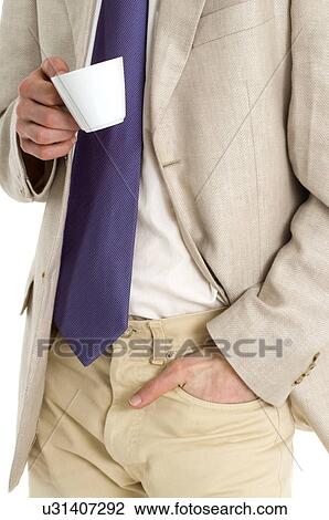 Young man with sports coat on holding coffee cup View Large Photo Image Stock Image - Young man with sports coat on holding coffee cup. Fotosearch