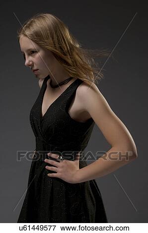 Stock Photo - Young model in black dress. Fotosearch