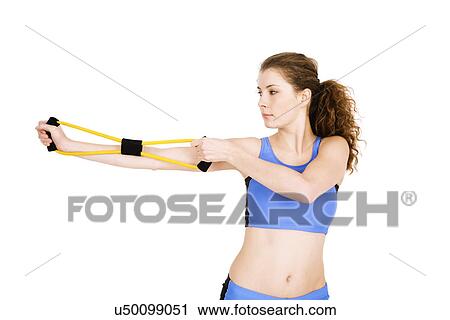 Young woman exercising View Large Photo Image Stock Image - Young woman exercising. Fotosearch