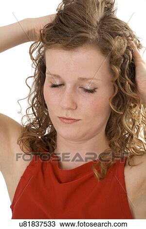 Young woman with curly brown hair View Large Photo Image Stock Image - Young woman with curly brown hair. Fotosearch