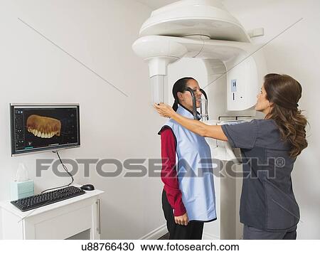 Assistant making x-ray image of patient teeth View Large Photo Image Stock Image - Assistant making x-ray image of patient teeth. Fotosearch