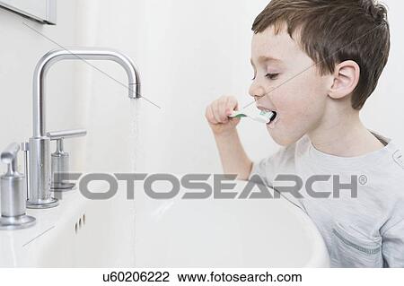 boy (6-7) brushing teeth View Large Photo Image Stock Image - boy (6-7) brushing teeth. Fotosearch