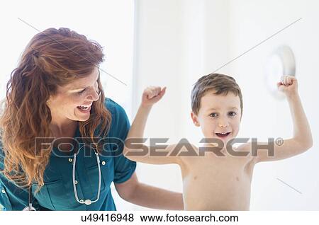 Stock Photo - boy (6-7) undergoing medical exam. Fotosearch