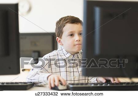 boy (6-7) using computer View Large Photo Image Stock Image - boy (6-7) using computer. Fotosearch
