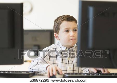 boy (6-7) using computer View Large Photo Image Stock Photography - boy (6-7) using computer. Fotosearch
