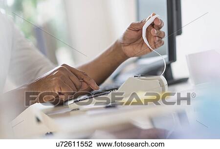 Close up of man's hands using calculator View Large Photo Image Stock Image - Close up of man's hands using calculator. Fotosearch