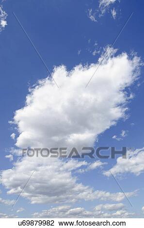 Stock Image - Clouds on blue sky. Fotosearch