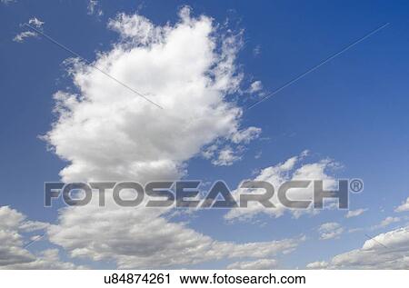 Stock Image - Clouds on blue sky. Fotosearch