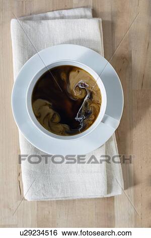 Coffee cup on table View Large Photo Image Stock Photograph - Coffee cup on table . Fotosearch