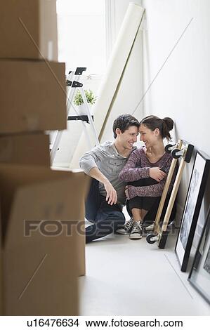 Picture - Couple in new home. Fotosearch