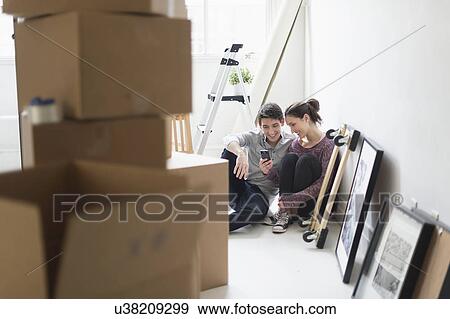 Couple in new home View Large Photo Image Stock Photo - Couple in new home. Fotosearch