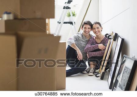 Couple in new home View Large Photo Image Stock Photography - Couple in new home. Fotosearch