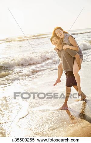 Couple on beach View Large Photo Image Stock Photography - Couple on beach. Fotosearch