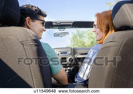 Stock Photo - Couple sitting in car. Fotosearch