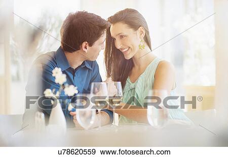 Couple sitting in restaurant View Large Photo Image Stock Photo - Couple sitting in restaurant. Fotosearch