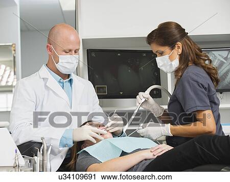 Dentist operation on patient View Large Photo Image Stock Image - Dentist operation on patient. Fotosearch