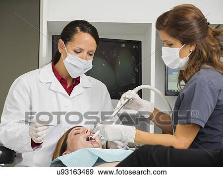 Dentist operation on patient View Large Photo Image Stock Photo - Dentist operation on patient. Fotosearch