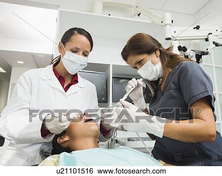 Stock Photograph - Dentist operation on patient(10-11). Fotosearch